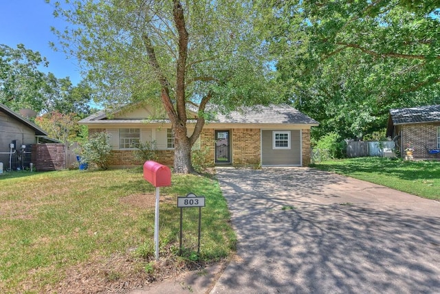 803 Easy Day Cv, Austin, TX 78745 - ranch-style home featuring brick siding and driveway