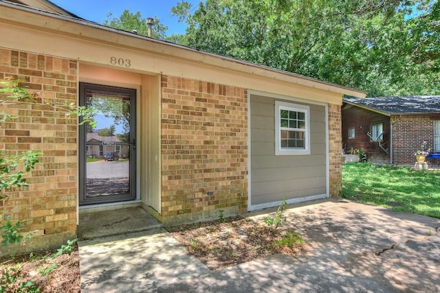 803 Easy Day Cv, Austin, TX 78745 - doorway to property with brick siding and a patio