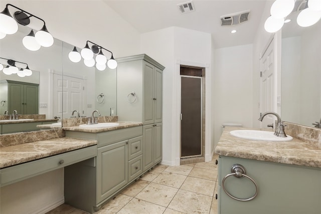 1708 Shag Bark Trl, Austin, TX 78758 - full bath with a stall shower, two vanities, and tile patterned flooring