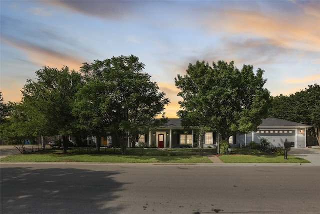 1708 Shag Bark Trl, Austin, TX 78758 - view of property hidden behind natural elements with an attached garage and driveway