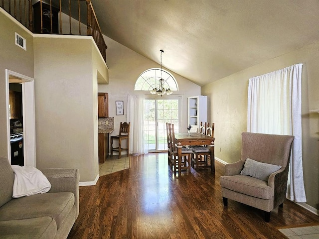 1202 Bowen Ave, Copperas Cove, TX 76522 - living room with a chandelier, high vaulted ceiling, and wood finished floors