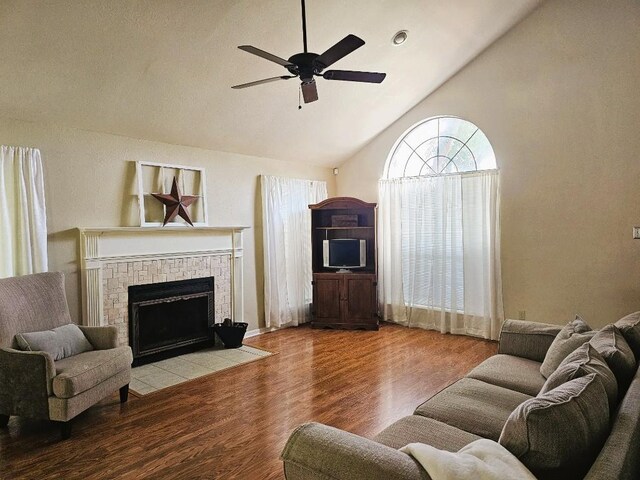 1202 Bowen Ave, Copperas Cove, TX 76522 - living room with wood finished floors, a ceiling fan, high vaulted ceiling, and a fireplace
