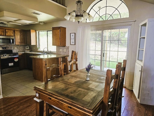 1202 Bowen Ave, Copperas Cove, TX 76522 - dining room featuring a chandelier and dark wood-style flooring