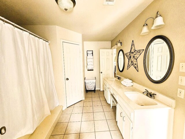 1202 Bowen Ave, Copperas Cove, TX 76522 - full bathroom with tile patterned flooring, double vanity, and a shower with shower curtain