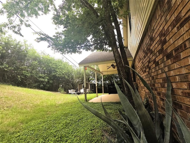 1202 Bowen Ave, Copperas Cove, TX 76522 - view of grassy yard with ceiling fan and a patio