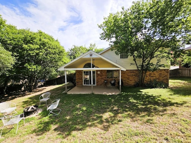 1202 Bowen Ave, Copperas Cove, TX 76522 - rear view of property featuring a patio area, an outdoor fire pit, and brick siding