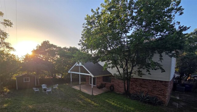 1202 Bowen Ave, Copperas Cove, TX 76522 - rear view of property featuring a shed, a patio area, and brick siding