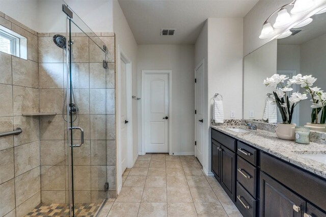 1624 Stone House Dr, New Braunfels, TX 78132 - full bathroom with double vanity, a stall shower, and tile patterned floors