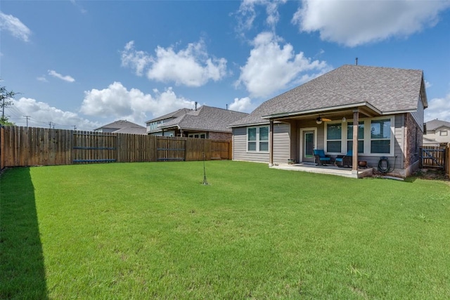 1624 Stone House Dr, New Braunfels, TX 78132 - back of property featuring a fenced backyard, a patio, roof with shingles, and a ceiling fan