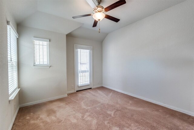 1624 Stone House Dr, New Braunfels, TX 78132 - empty room with light carpet, plenty of natural light, a ceiling fan, and vaulted ceiling