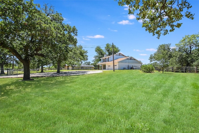 3112 Oak Ridge Dr, Horseshoe Bay, TX 78657 - view of yard with an attached garage and driveway