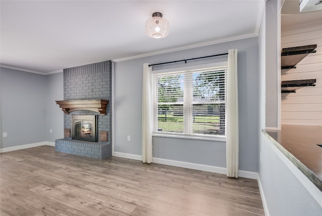 3112 Oak Ridge Dr, Horseshoe Bay, TX 78657 - unfurnished living room featuring crown molding, wood finished floors, and a fireplace