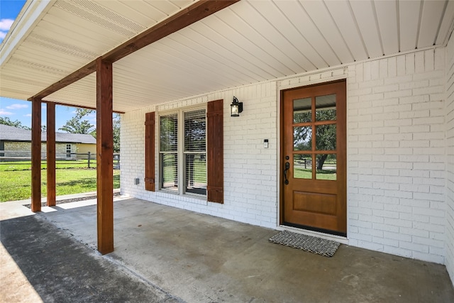 3112 Oak Ridge Dr, Horseshoe Bay, TX 78657 - doorway to property with covered porch and brick siding