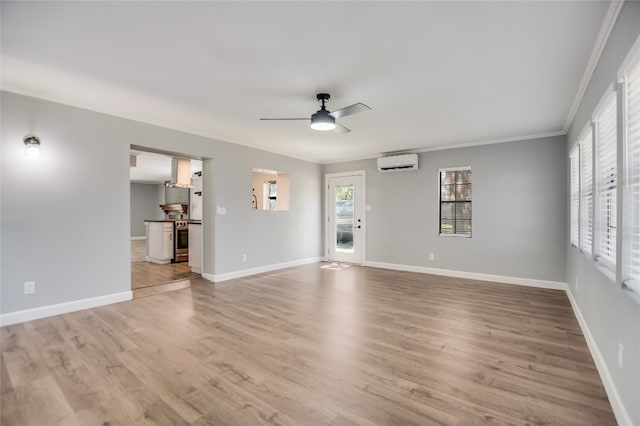 3112 Oak Ridge Dr, Horseshoe Bay, TX 78657 - unfurnished living room with a wall mounted air conditioner, ceiling fan, crown molding, and light wood-style flooring