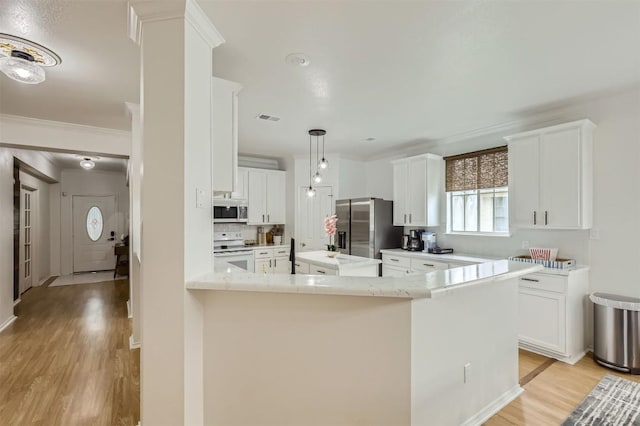 1016 Thackeray Ln, Pflugerville, TX 78660 - kitchen with stainless steel fridge, white electric range oven, light wood finished floors, white cabinetry, and ornamental molding
