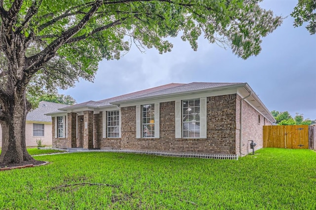 1016 Thackeray Ln, Pflugerville, TX 78660 - view of front of home featuring brick siding and roof with shingles