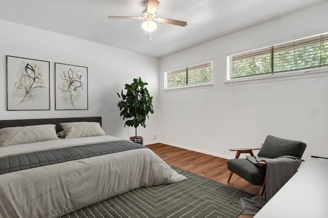 9611 Meadowheath Dr, Austin, TX 78729 - bedroom with wood finished floors and ceiling fan