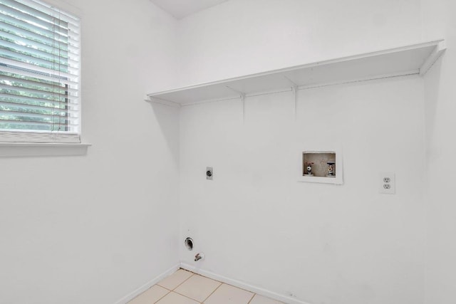 9611 Meadowheath Dr, Austin, TX 78729 - laundry room with electric dryer hookup, washer hookup, hookup for a gas dryer, and light tile patterned floors