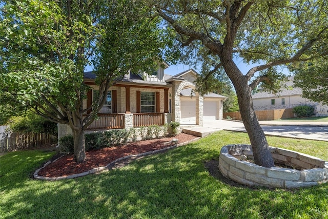 4204 Pasada Ln, Round Rock, TX 78681 - view of property hidden behind natural elements with covered porch, stone siding, driveway, and an attached garage
