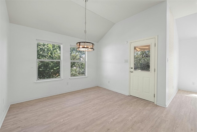 4204 Pasada Ln, Round Rock, TX 78681 - unfurnished dining area featuring lofted ceiling, light wood-style floors, a chandelier, and healthy amount of natural light