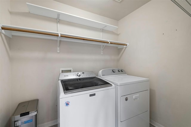 4204 Pasada Ln, Round Rock, TX 78681 - laundry area with washer and clothes dryer and baseboards
