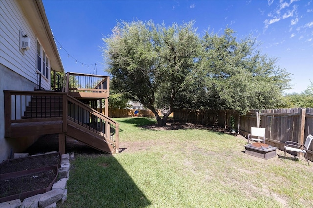 4204 Pasada Ln, Round Rock, TX 78681 - fenced backyard with stairway, a fire pit, and a wooden deck