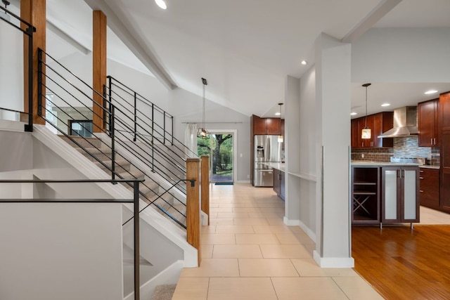 5210 Rain Creek Pkwy, Austin, TX 78759 - staircase featuring lofted ceiling, tile patterned floors, and recessed lighting