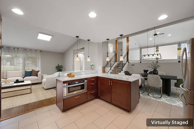 5210 Rain Creek Pkwy, Austin, TX 78759 - kitchen featuring appliances with stainless steel finishes, open floor plan, plenty of natural light, light countertops, and recessed lighting