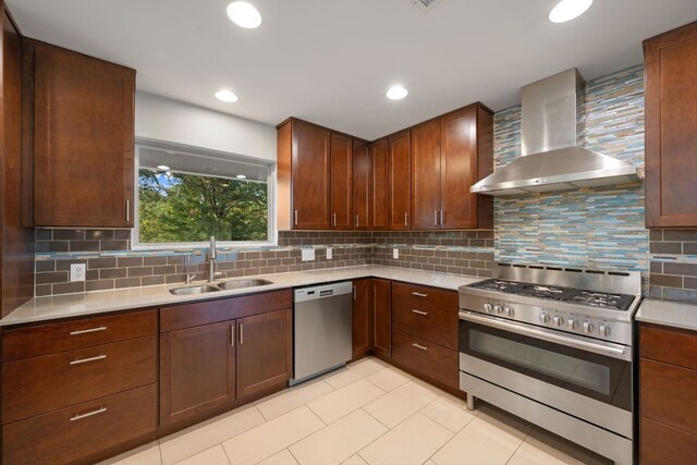 5210 Rain Creek Pkwy, Austin, TX 78759 - kitchen with stainless steel appliances, wall chimney range hood, light countertops, tasteful backsplash, and recessed lighting