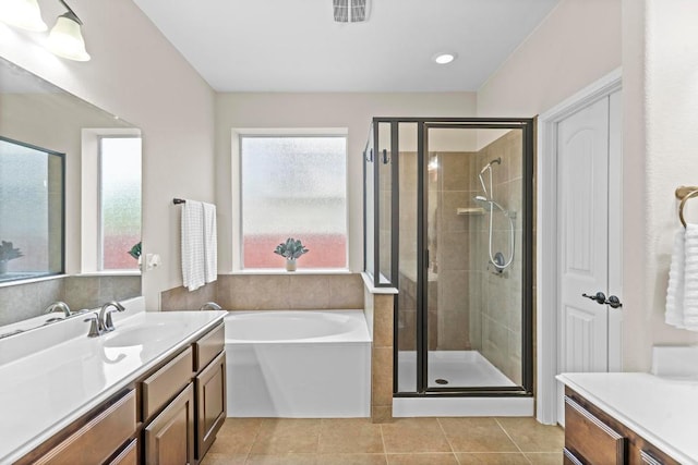 112 Florenz Ln, Georgetown, TX 78628 - bathroom featuring vanity, a bath, a shower stall, and tile patterned flooring