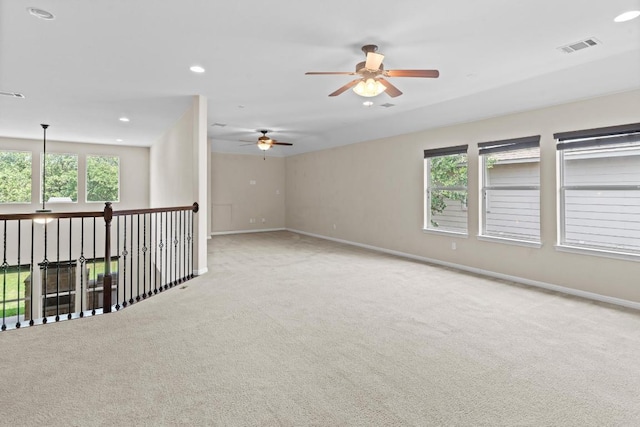 112 Florenz Ln, Georgetown, TX 78628 - empty room with carpet floors, plenty of natural light, a ceiling fan, and recessed lighting