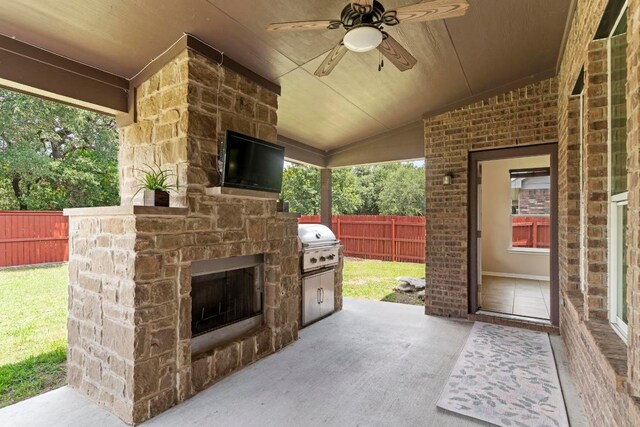 112 Florenz Ln, Georgetown, TX 78628 - view of patio featuring an outdoor stone fireplace, area for grilling, and ceiling fan