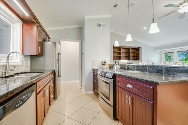 100 Bay Point Dr Unit 13, Horseshoe Bay, TX 78657 - kitchen featuring appliances with stainless steel finishes, lofted ceiling, tasteful backsplash, crown molding, and pendant lighting