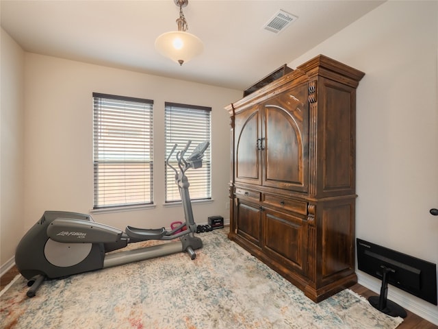 22617 Fountaingrass Ln, Lago Vista, TX 78645 - exercise room with baseboards and wood finished floors