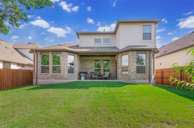 22617 Fountaingrass Ln, Lago Vista, TX 78645 - back of house featuring a fenced backyard, a patio area, brick siding, and stucco siding