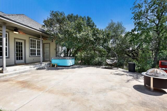 1906 W Moeta Dr, Austin, TX 78734 - view of patio / terrace with a hot tub, ceiling fan, and an outdoor fire pit