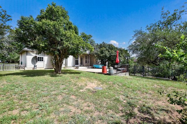 1906 W Moeta Dr, Austin, TX 78734 - fenced backyard featuring a patio