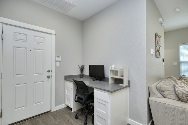 125 Hawea Ln, Bastrop, TX 78602 - office featuring dark wood finished floors and baseboards