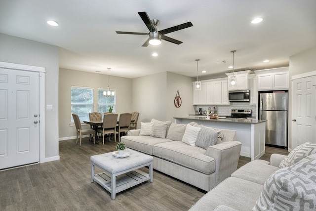 125 Hawea Ln, Bastrop, TX 78602 - living room with dark wood-type flooring, a ceiling fan, and recessed lighting