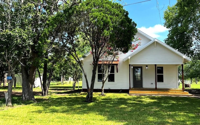 1105 Carroll Ln, La Grange, TX 78945 - view of front of house featuring a porch and a front lawn
