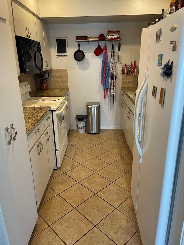 2612 San Pedro St Unit 224, Austin, TX 78705 - kitchen featuring white appliances, light tile patterned floors, white cabinets, and stone countertops