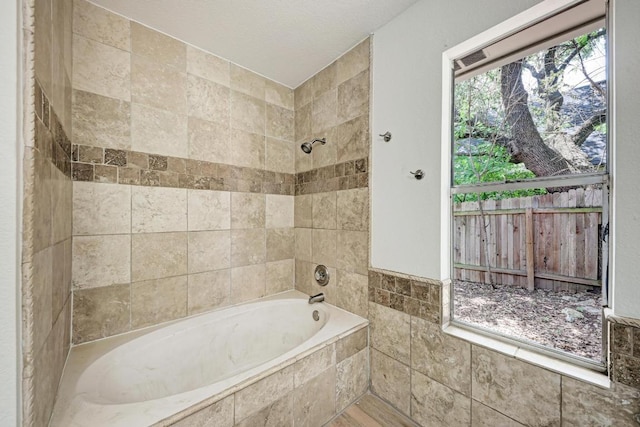 2705 Sabinal Trl, Cedar Park, TX 78613 - full bathroom featuring tiled shower / bath and tile walls