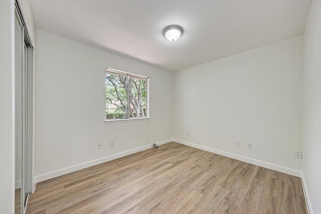 2705 Sabinal Trl, Cedar Park, TX 78613 - unfurnished room featuring light wood-type flooring and a textured ceiling