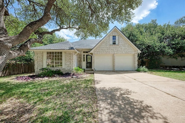 2705 Sabinal Trl, Cedar Park, TX 78613 - view of front of home with concrete driveway, brick siding, a garage, and a shingled roof