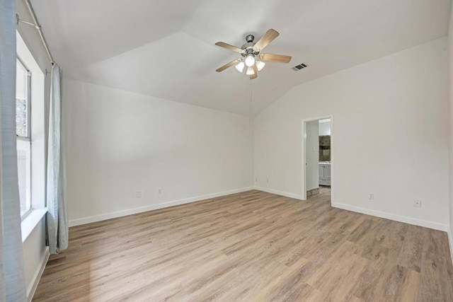 2705 Sabinal Trl, Cedar Park, TX 78613 - spare room featuring lofted ceiling, ceiling fan, light wood-type flooring, and plenty of natural light