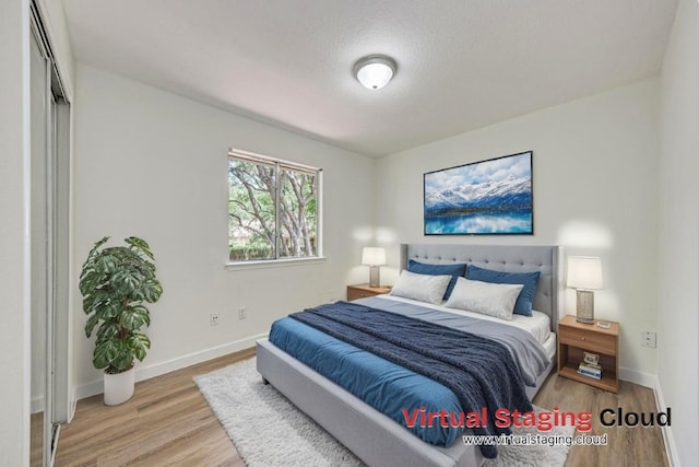 2705 Sabinal Trl, Cedar Park, TX 78613 - bedroom featuring wood finished floors and a textured ceiling