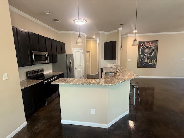 208 Akaloa Dr, Bastrop, TX 78602 - kitchen featuring appliances with stainless steel finishes, ornamental molding, dark cabinetry, light stone countertops, and a kitchen breakfast bar