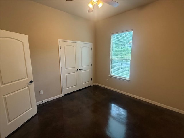 208 Akaloa Dr, Bastrop, TX 78602 - unfurnished bedroom featuring a ceiling fan and finished concrete floors