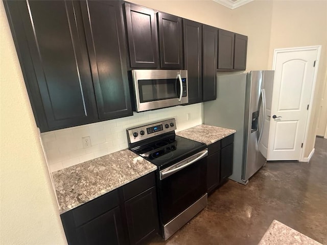 208 Akaloa Dr, Bastrop, TX 78602 - kitchen with stainless steel appliances, finished concrete floors, tasteful backsplash, light stone counters, and ornamental molding