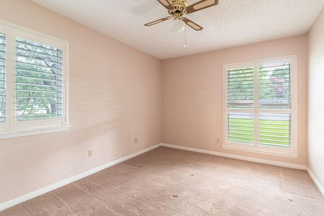 3801 Oak Creek Dr, Austin, TX 78727 - carpeted spare room with a textured ceiling and ceiling fan